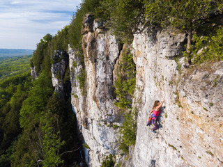 A beautiful woman rock climbing in Ontario, Canada.