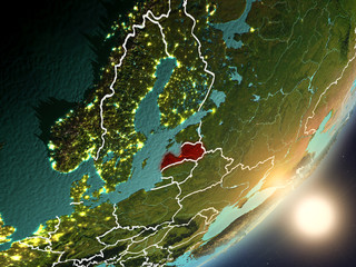 Sun rising above Latvia from space