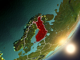 Sun rising above Finland from space
