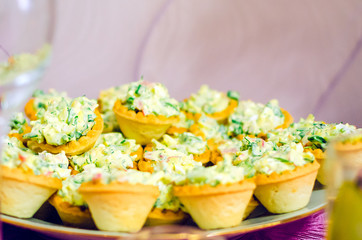 Baked tartlets with filling. Festive dishes.