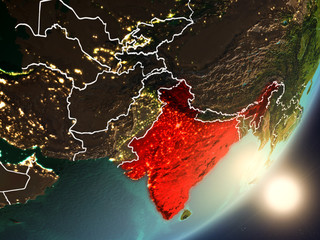 Sun rising above India from space