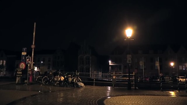 rain and lightning strike at night in the city of Mechelen, Belgium