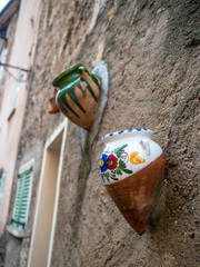pottery jars decoration on Provence house wall