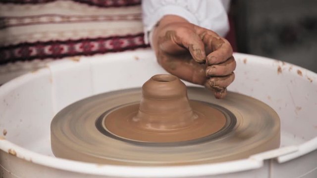 Process Of Creating A Clay Pot. Using Hands. Pottery Craft Wheel And Ceramic Clay Pot