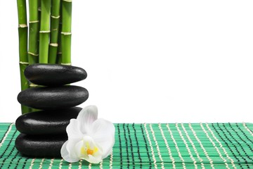 Balancing Pebbles with Bamboo and Flower