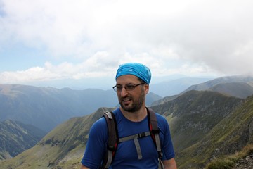 Climber portrait - man on the highest peek