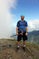 Climber portrait - man on the highest peek