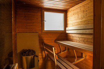 Sauna of light wood with a window