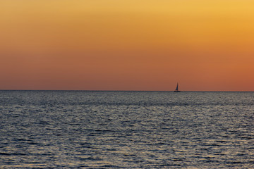 Fototapeta na wymiar sunset sea boat minimal