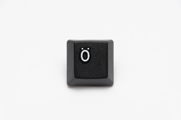 Single black keys of keyboard with different letters Ö