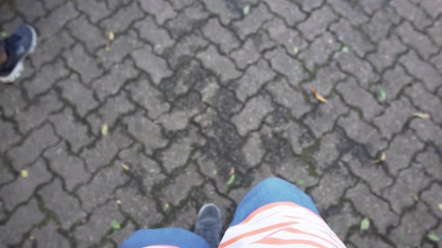 Shot of a Mans feet walking on the sidewalk in Cape Town, in Slow Motion