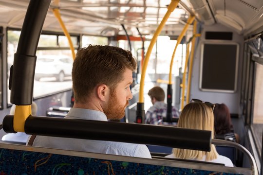Man travelling in modern bus