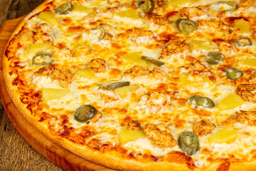 Pizza with pineapple and chicken