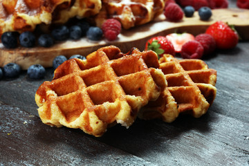 Traditional belgian waffles with fresh mint, sugar and raspberries.