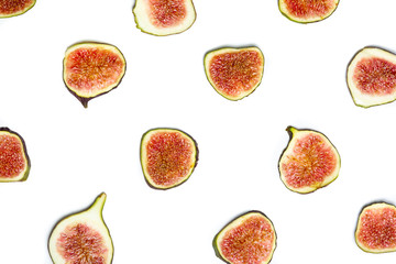 Top view of the ripe fig slices forming an abstract background pattern on white.