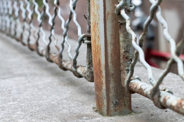 metal fence on concrete foundation