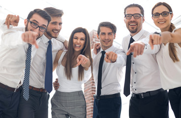 close up.a successful business team pointing to you