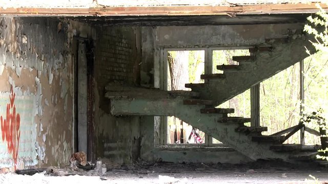 Military hand grenade explosion on background of destroyed house. Impact strength and power of airsoft guns.
