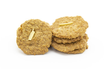 pile of cookies with sliced almond on white background