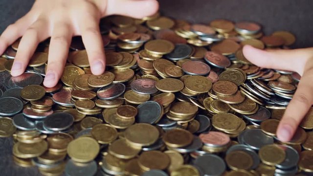 Coins in hands. Money concept.