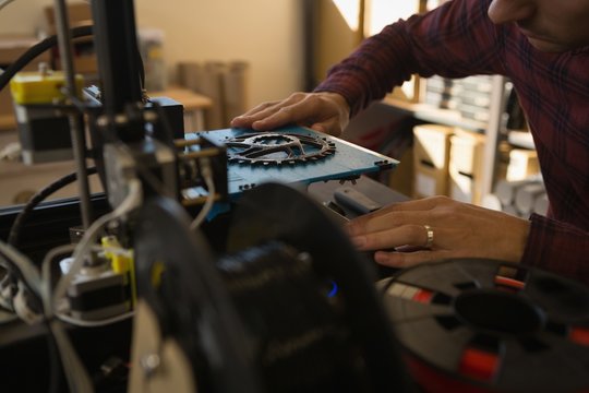 Mechanic working on die machine