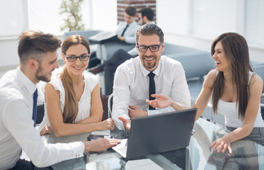 group of business people sitting at the Desk