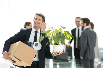 young employee on the background of a new workplace