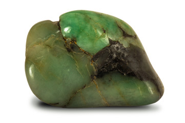 Polished low quality emerald stone isolated on white background