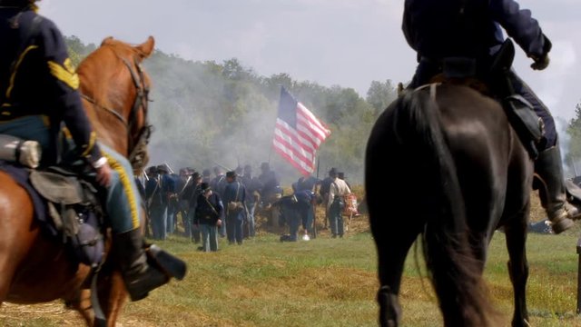 Union soldier waving a flag.