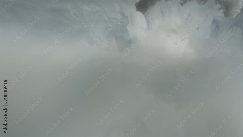 Aufkleber slow motion white ink dropped into water tank with a black background. for use with visual effects a