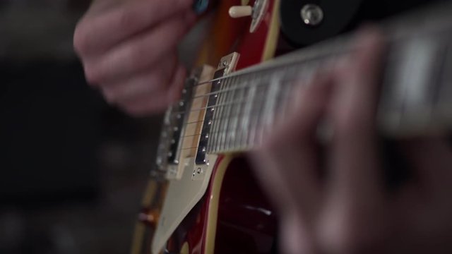 Loosely strumming chords on a guitar