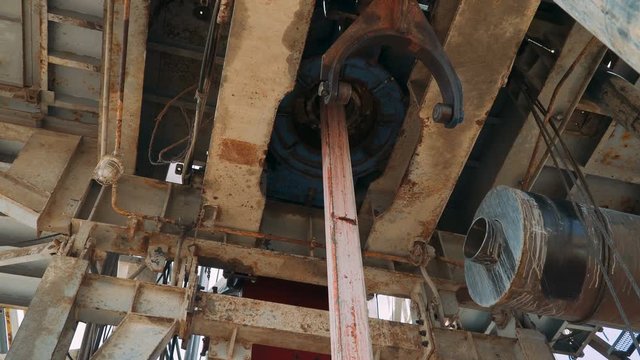 Drill pipe rotating in the rotary table for Oil Drilling Rig - Oil and Gas Industry.