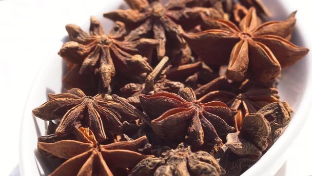 Dry spices anisetree on a rotary table. 4K. Macroshooting.