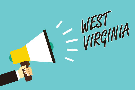 Text sign showing West Virginia. Conceptual photo United States of America State Travel Tourism Trip Historical Man holding megaphone loudspeaker blue background message speaking loud.