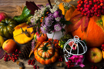 Fall decor with birdcage, apples and flowers