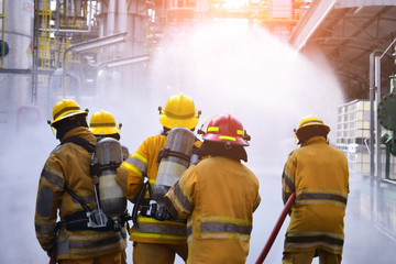 Naklejka premium A group of firefighters helped stop the fire.