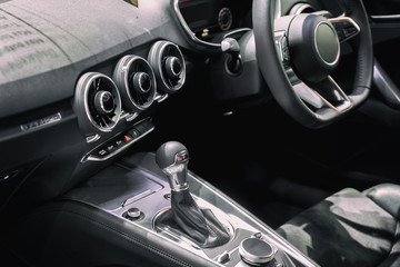 Luxury of car interior at transmission shift gear area. Modern car interior, gearstick radio and...