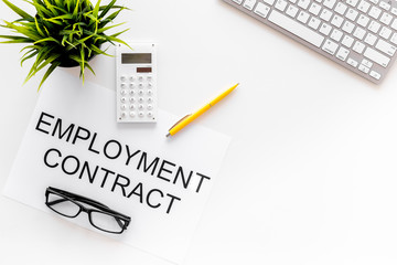 Recruitment concept. Words Employment contract on office desk with computer on white backround top...