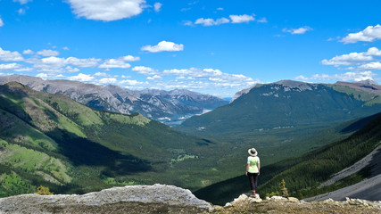 Vacation travel in Canadian Rocky Mountains. Woman hiking West Wind Pass in Kananaskis near Canmore. Alberta. Canada.