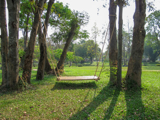 Swing wood seat on garden