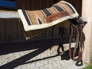 Colored horse saddle in a farm