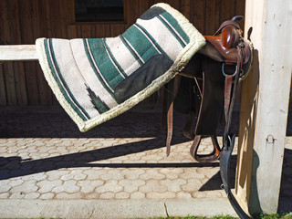Colored horse saddle in a farm