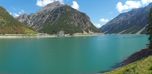 Fototapeta na wymiar Landscape of the Lake Livigno an alpine artificial lake. Italian Alps. Italy