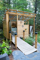 Outdoor shower and composting toilet stall at a glamping site