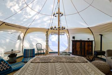 Interior of a glamping tent in a forest