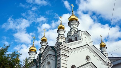 Fototapeta na wymiar Church on cloudy sky background Tomsk Russia