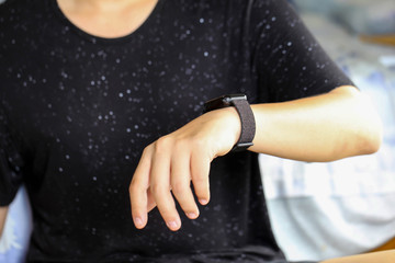 Man looking at his watch on his hand, watching the time using for concept Be Late For Something Day.