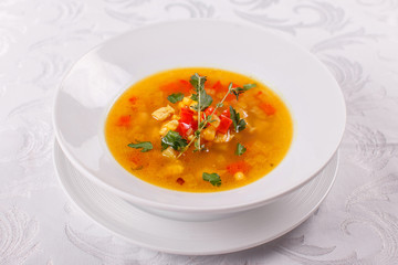 Fresh Mexican tomato soup with corn and vegetables. bowl of bean soup with rosemary. like chili con carne with tacos