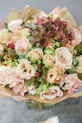 Floral Arrangement. Mix flowers. Beautiful summer bouquet. Concept of a flower shop. Profession florist