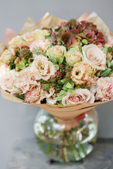 Floral Arrangement. Mix flowers. Beautiful summer bouquet. Concept of a flower shop. Profession florist